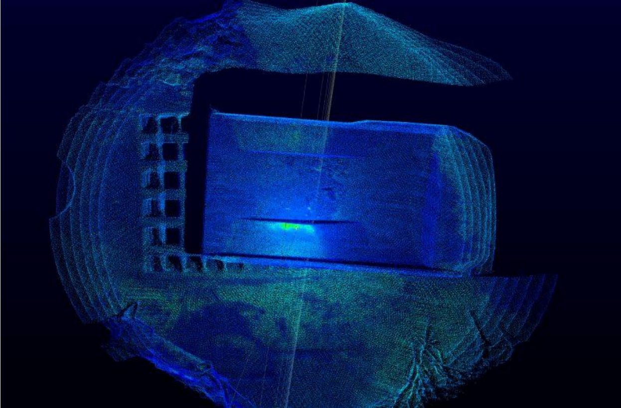 LiDAR point cloud of a haul-truck body and the surrounding unloading area.